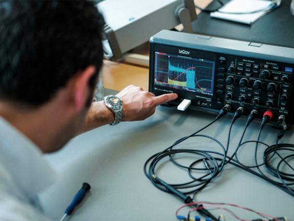 view over the shoulder of a lab technician on a lab instument